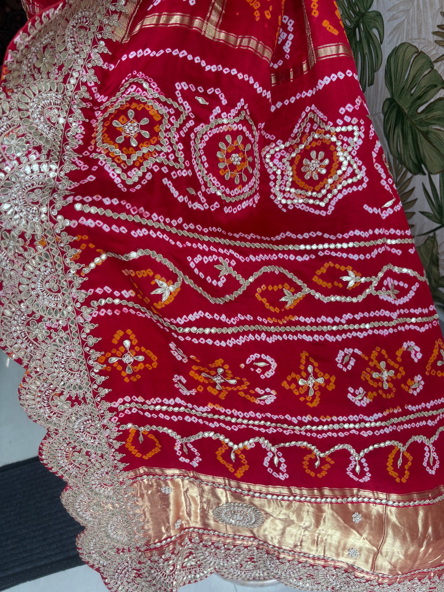 Draped in tradition, adorned with elegance. A timeless Red Ghatchola Saree for your grand celebrations.