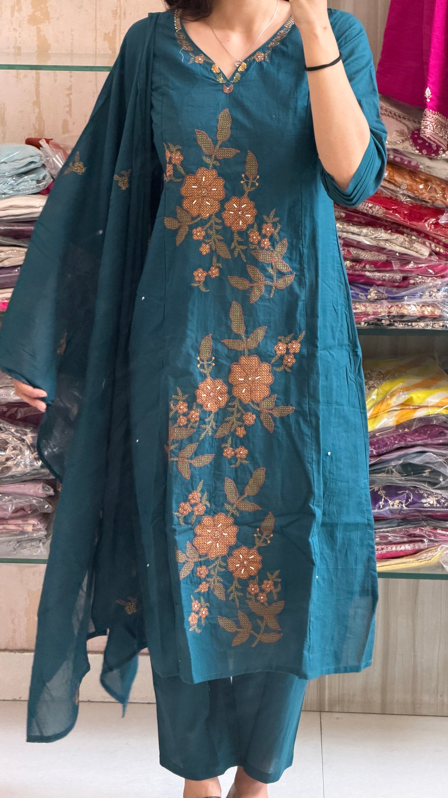 A timeless cotton suit set adorned with elegant floral embroidery