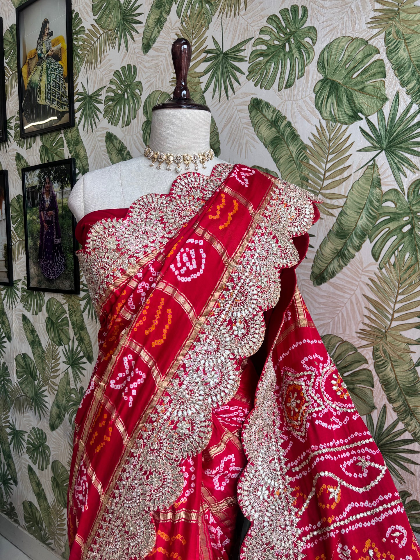Draped in tradition, adorned with elegance. A timeless Red Ghatchola Saree for your grand celebrations.