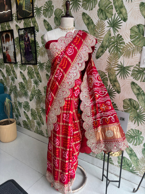Draped in tradition, adorned with elegance. A timeless Red Ghatchola Saree for your grand celebrations.
