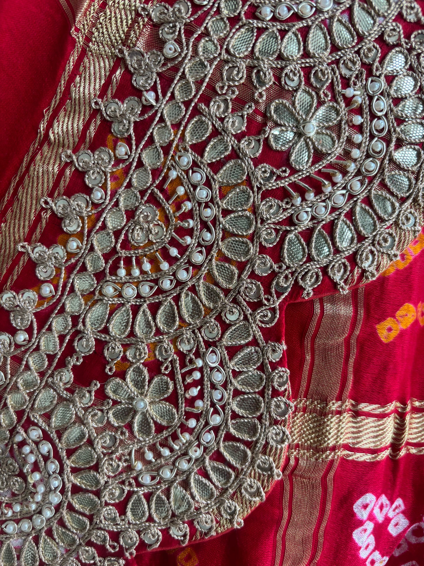 Draped in tradition, adorned with elegance. A timeless Red Ghatchola Saree for your grand celebrations.