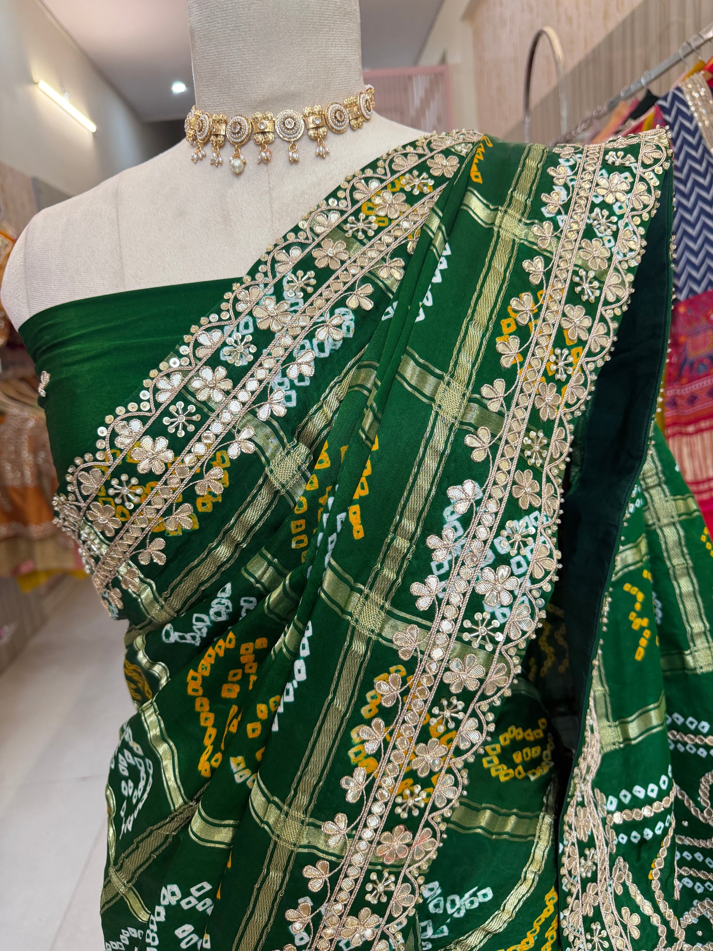Bottel green elegance woven in every drape. 💚✨ This exquisite Gajji Silk Bandhej Saree with delicate gota patti work