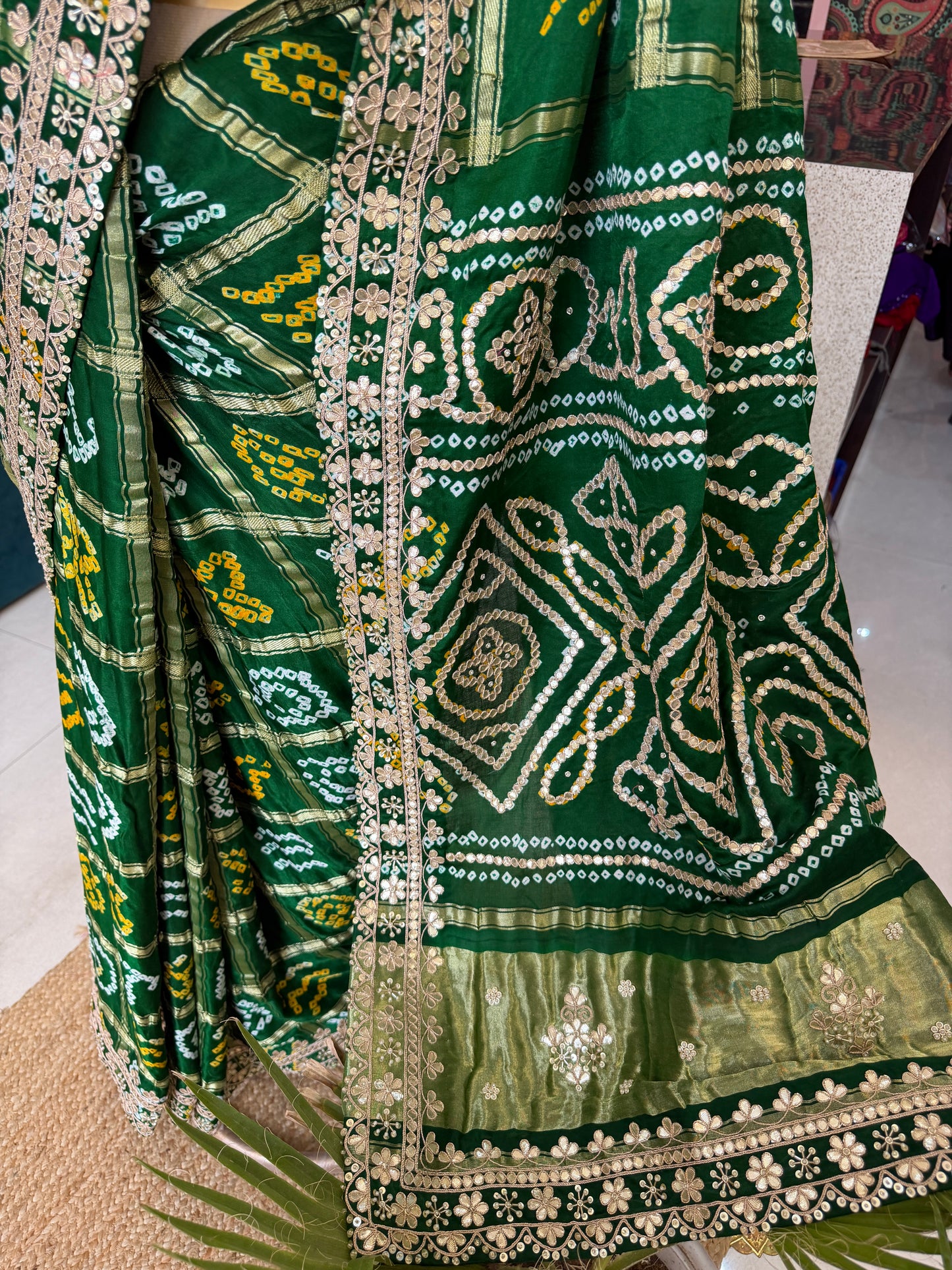 Bottel green elegance woven in every drape. 💚✨ This exquisite Gajji Silk Bandhej Saree with delicate gota patti work