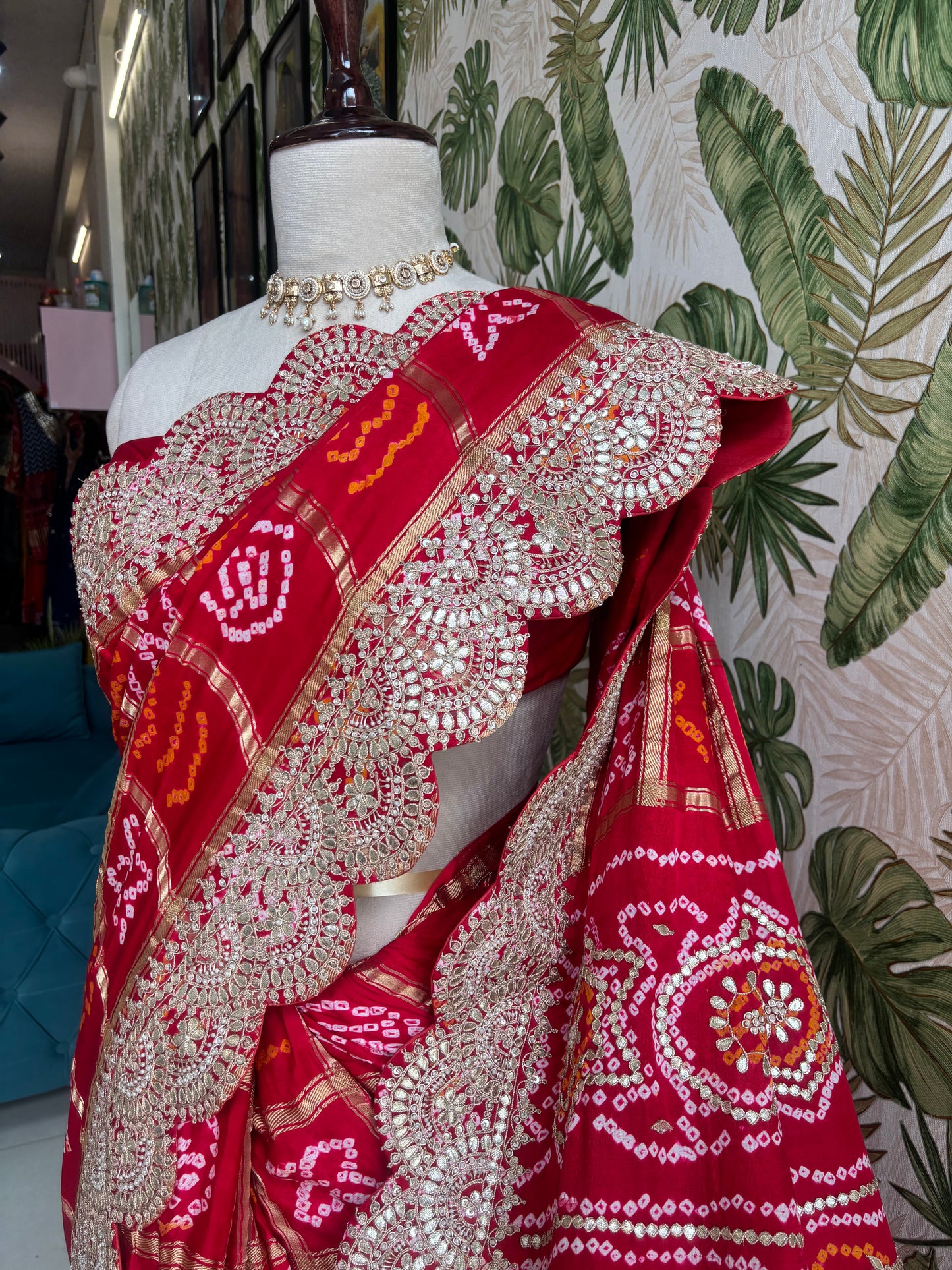 Draped in tradition, adorned with elegance. A timeless Red Ghatchola Saree for your grand celebrations.