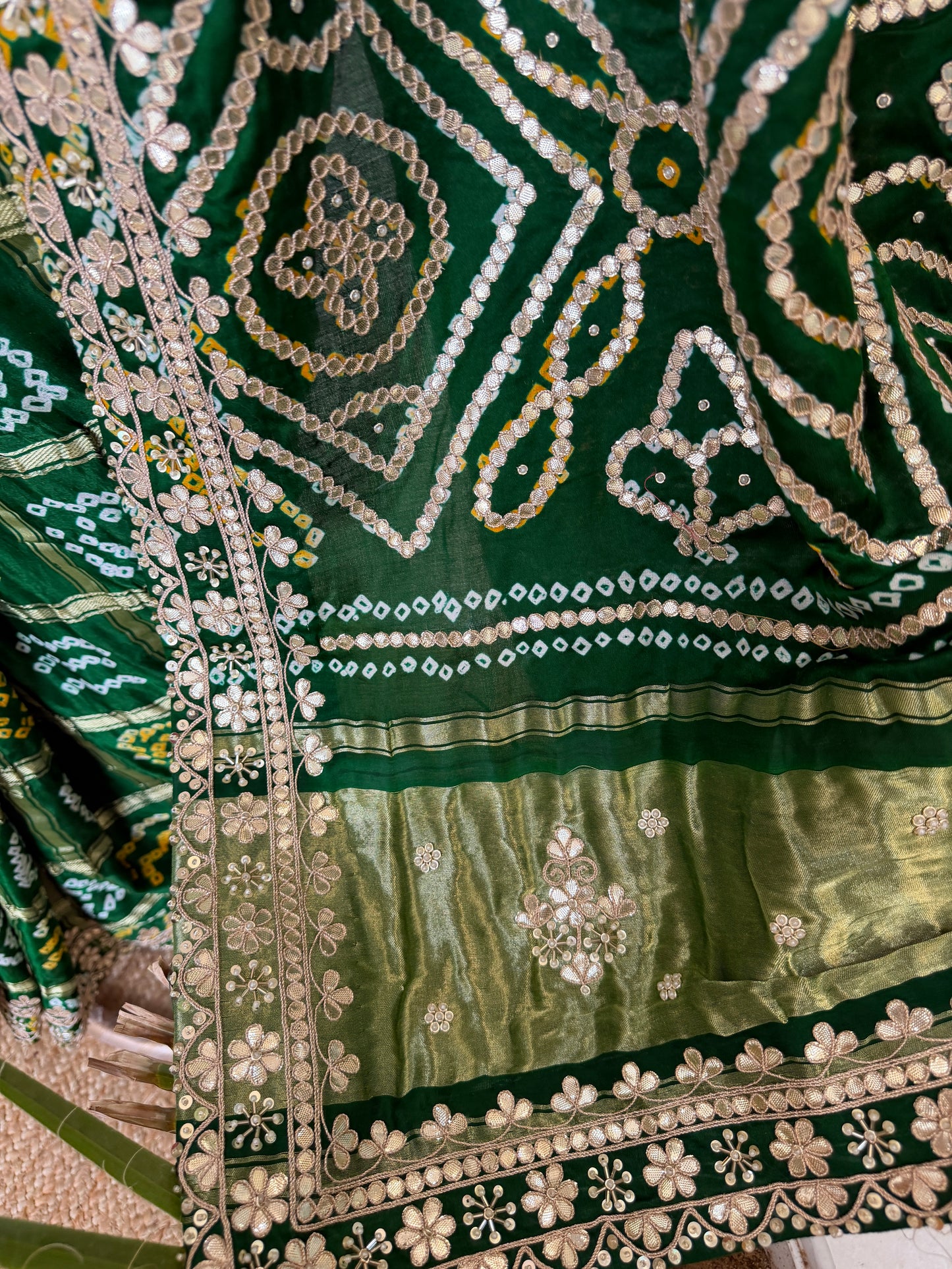 Bottel green elegance woven in every drape. 💚✨ This exquisite Gajji Silk Bandhej Saree with delicate gota patti work