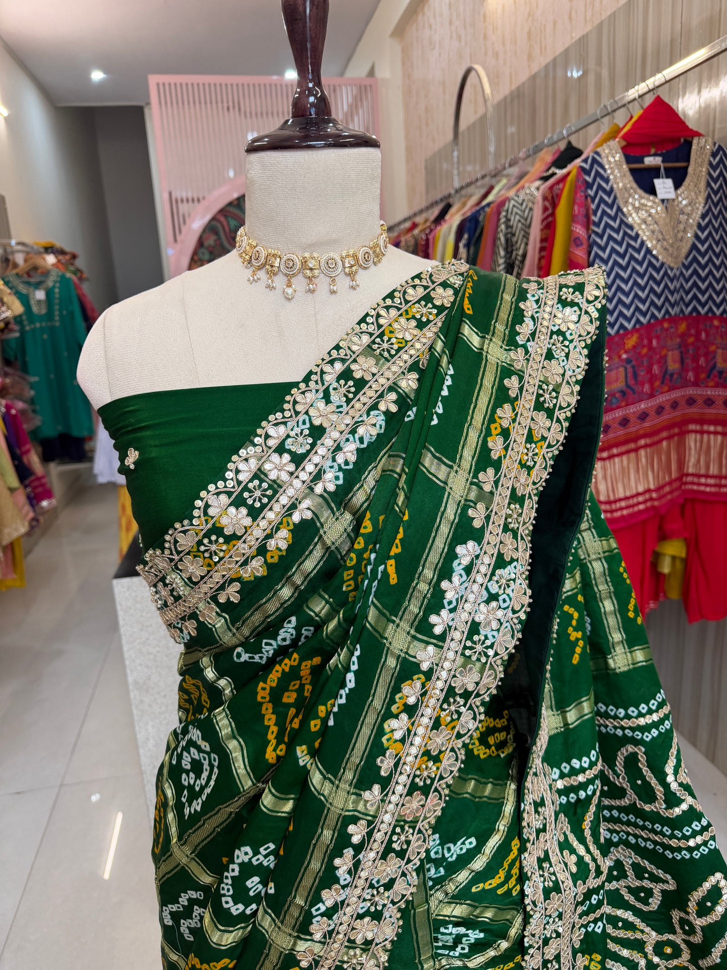 Bottel green elegance woven in every drape. 💚✨ This exquisite Gajji Silk Bandhej Saree with delicate gota patti work
