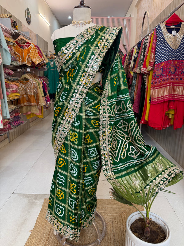 Bottel green elegance woven in every drape. 💚✨ This exquisite Gajji Silk Bandhej Saree with delicate gota patti work