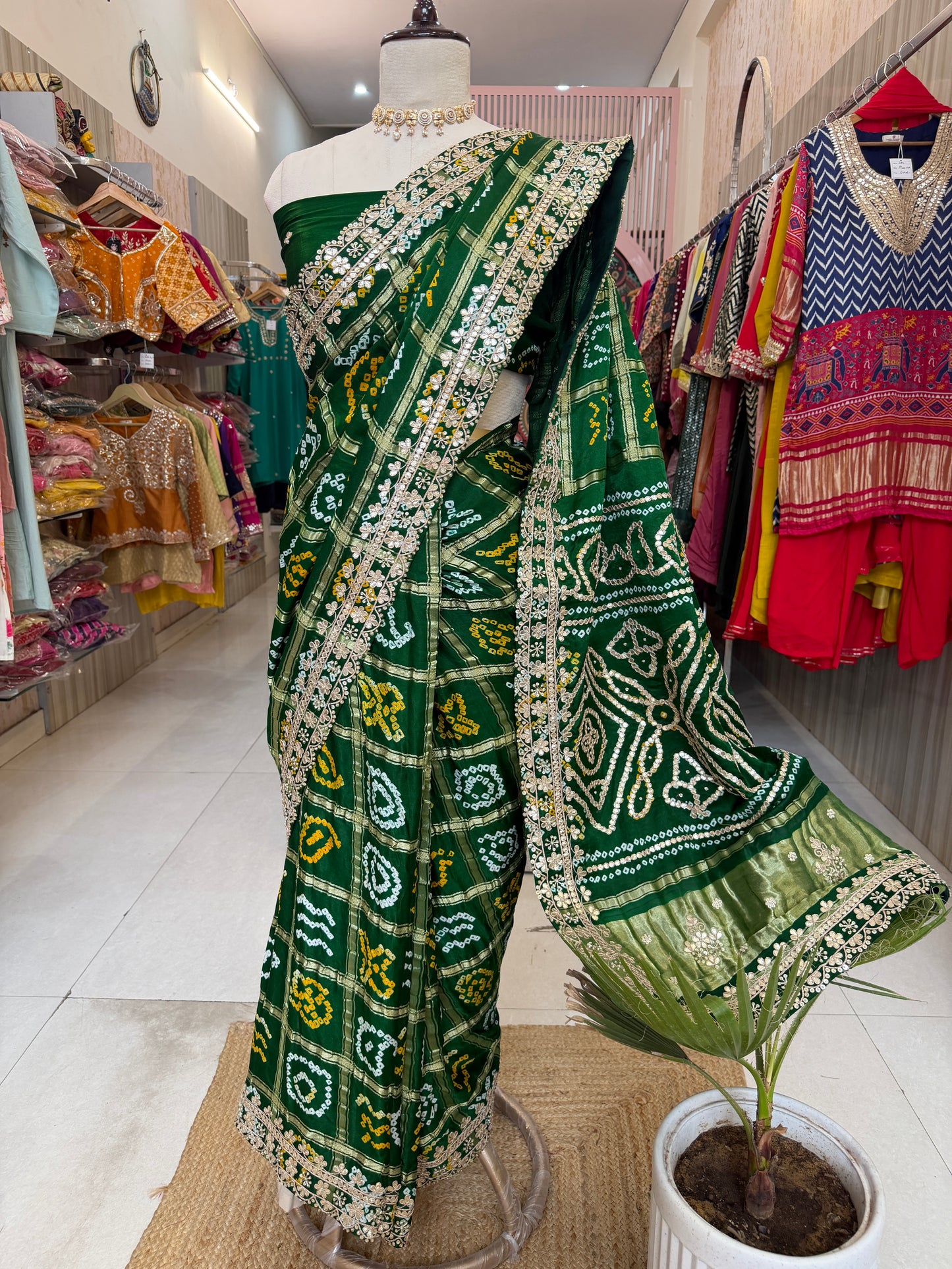 Bottel green elegance woven in every drape. 💚✨ This exquisite Gajji Silk Bandhej Saree with delicate gota patti work