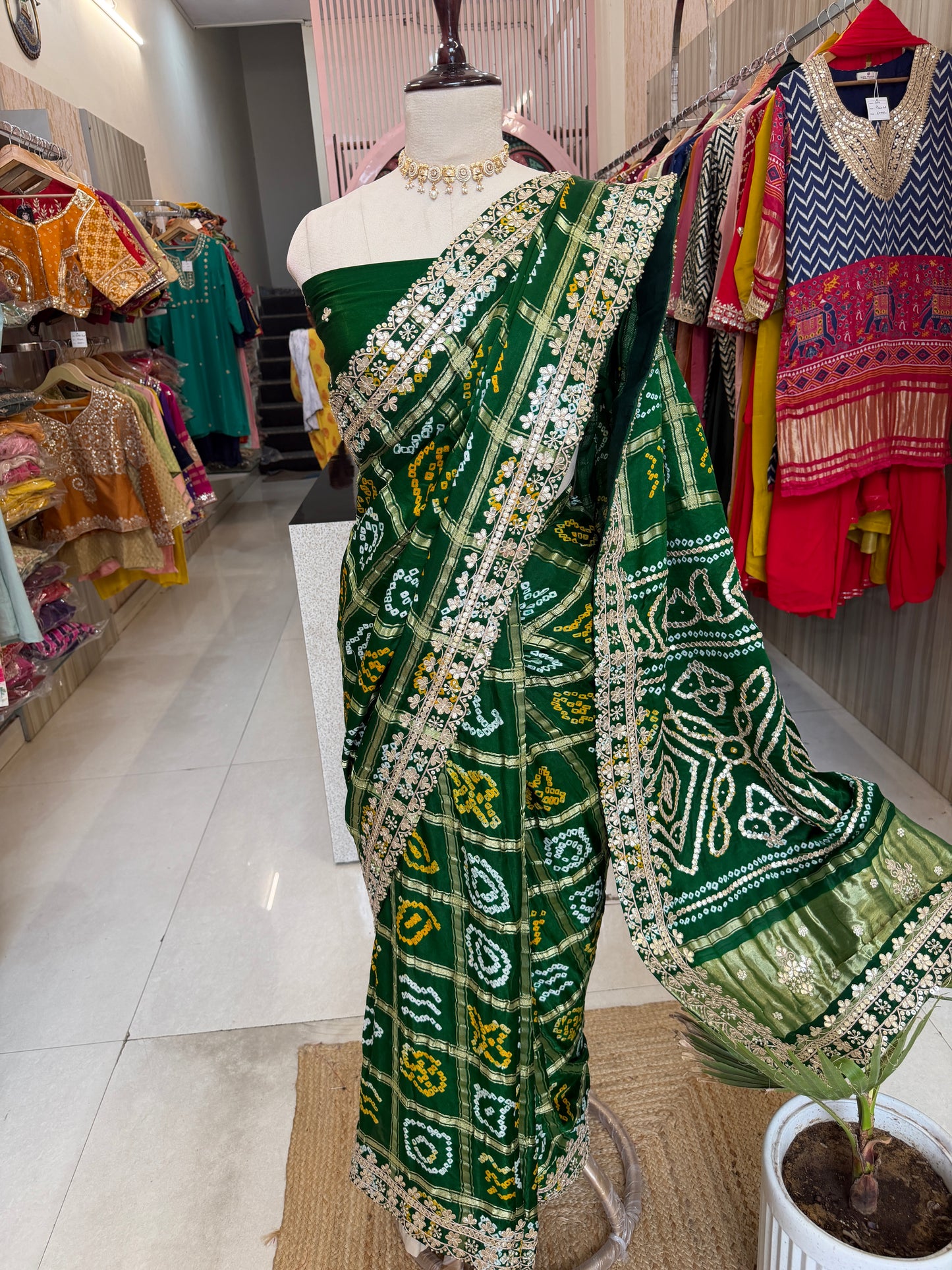 Bottel green elegance woven in every drape. 💚✨ This exquisite Gajji Silk Bandhej Saree with delicate gota patti work