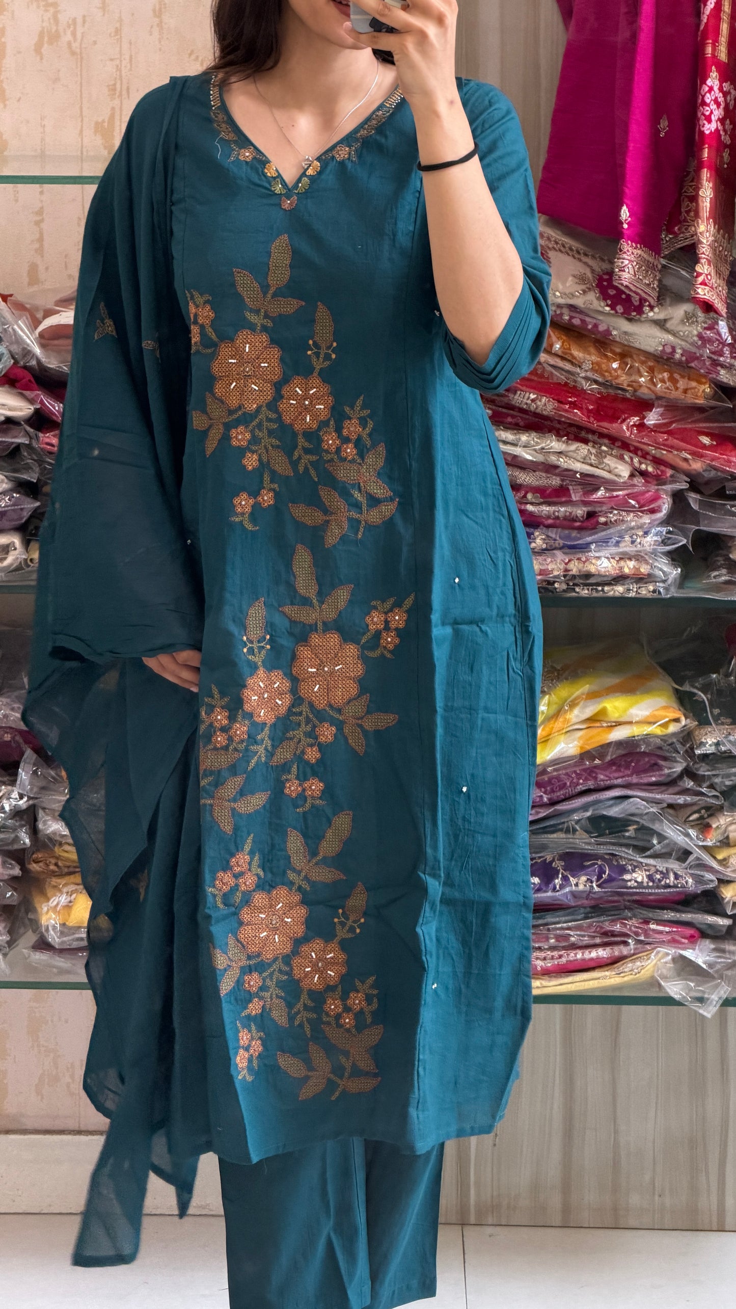 A timeless cotton suit set adorned with elegant floral embroidery