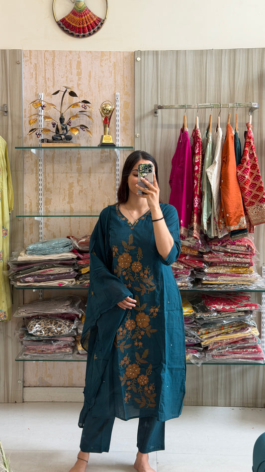 A timeless cotton suit set adorned with elegant floral embroidery