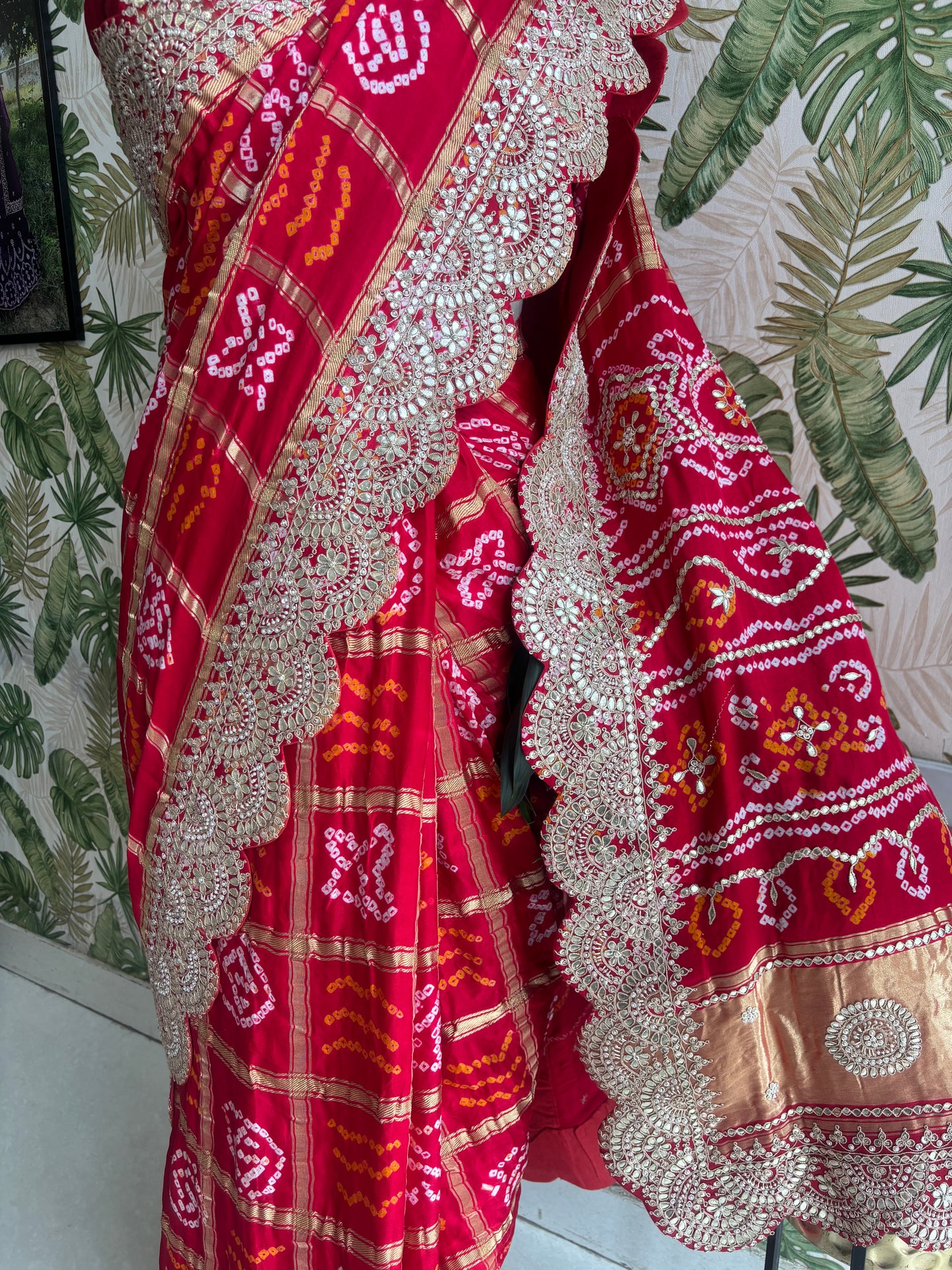 Draped in tradition, adorned with elegance. A timeless Red Ghatchola Saree for your grand celebrations.
